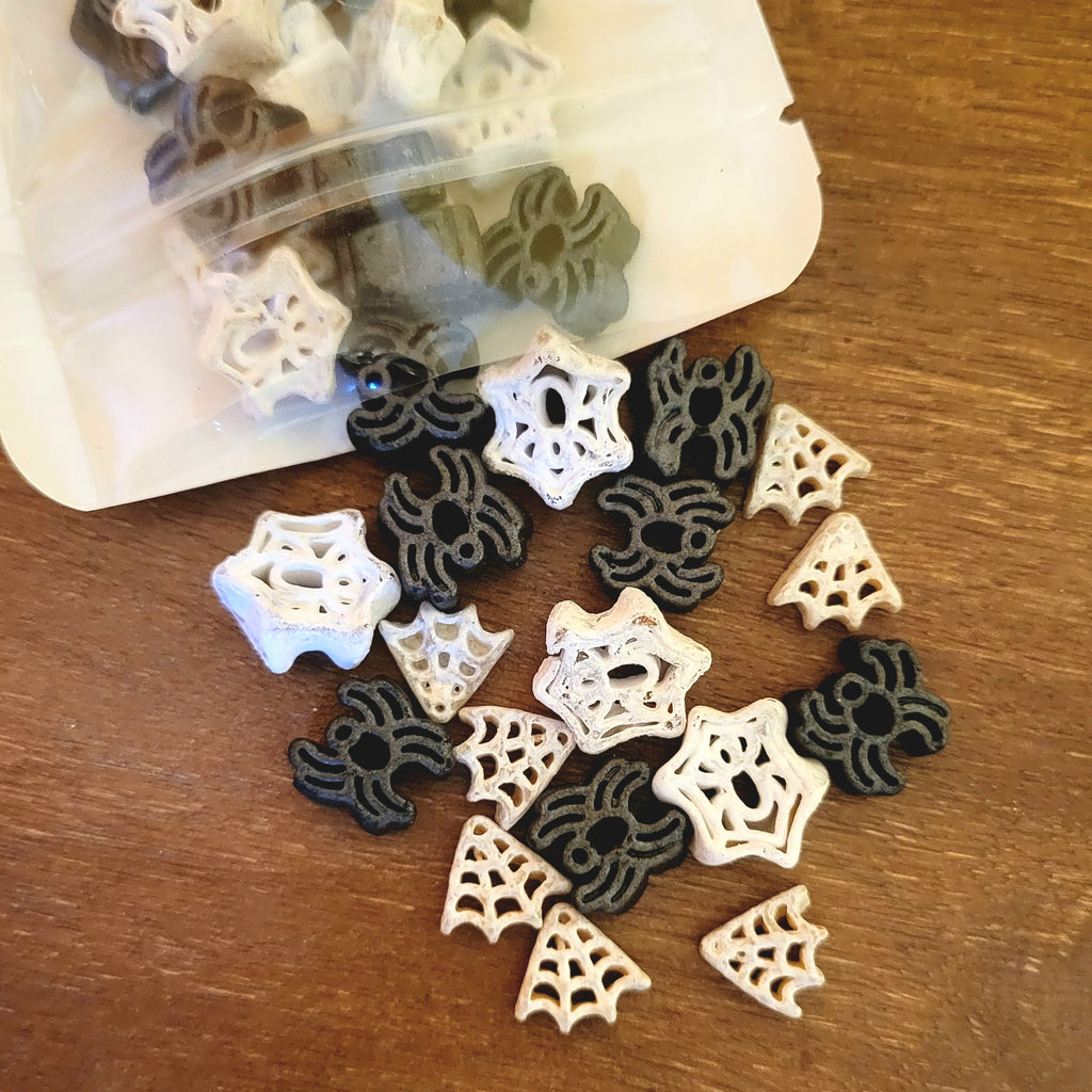 Black Spiders and White Spider Webs